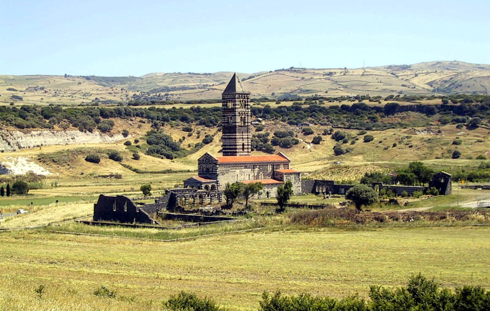 View of the Basilica of the Holy Trinity in Saccargia. Photos of the town of Codrongianos, from Sardegna DL